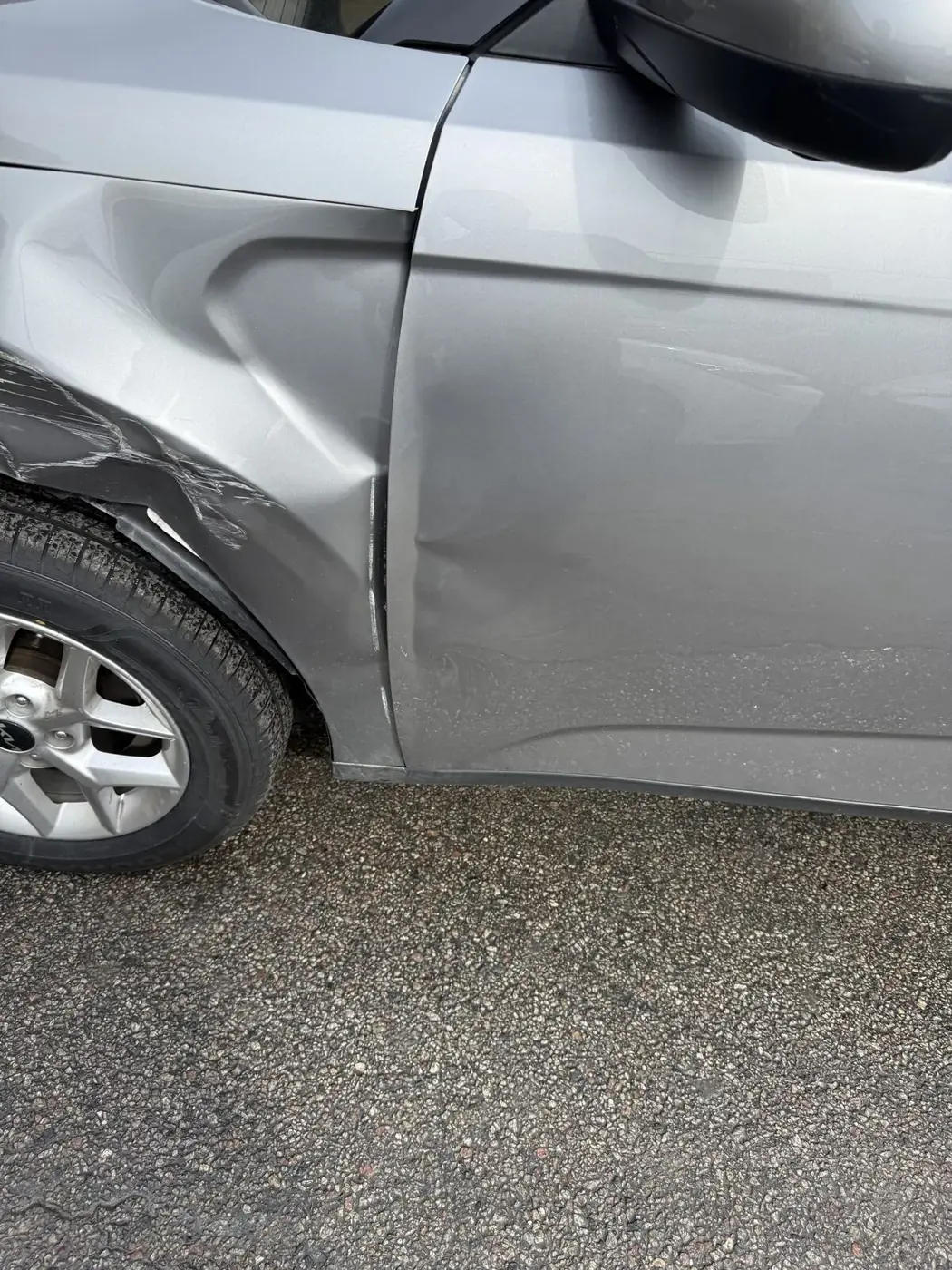 Same vehicle after body repair and refinishing, damage no longer visible