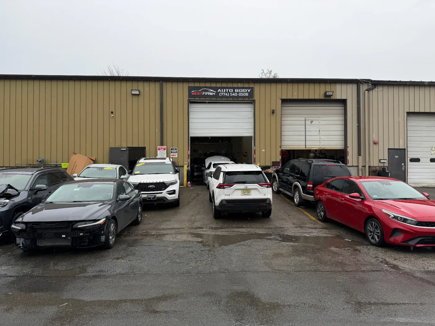 Wide view of the Best Finish Auto Body repair facility in Worcester, MA